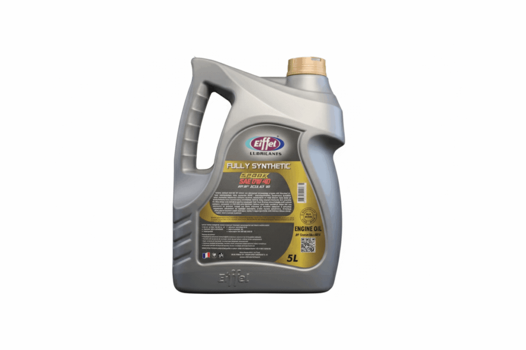 A gray plastic container of motor oil with a handle and yellow cap.