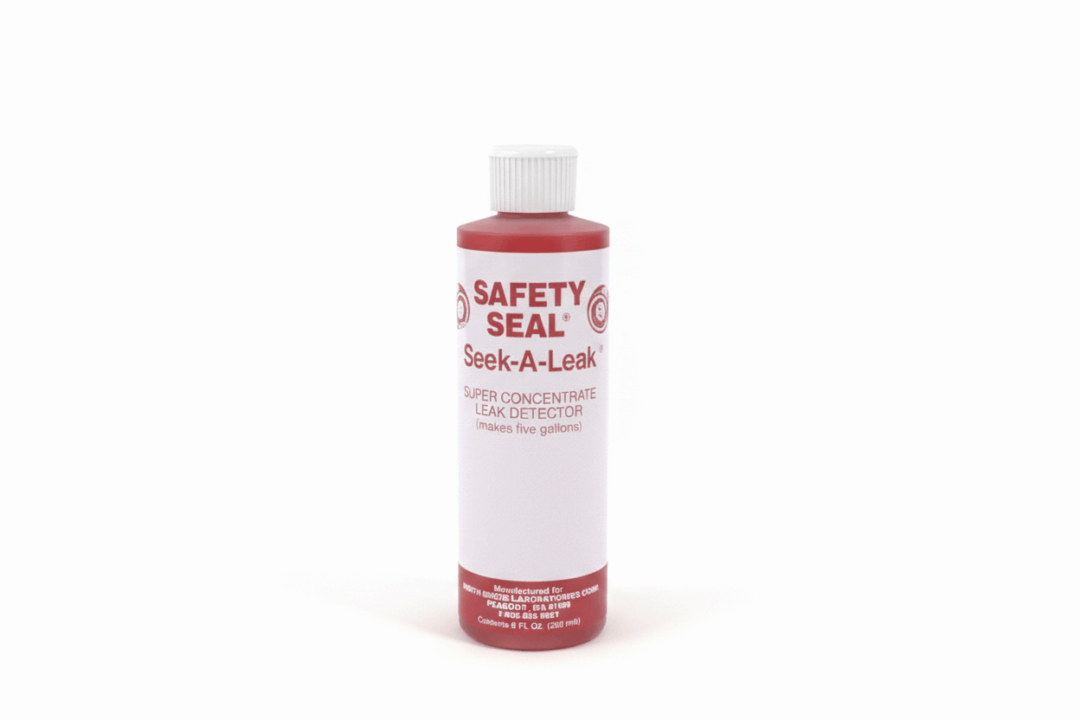 A white bottle of Safety Seal Leak-Stop solution with a red label.