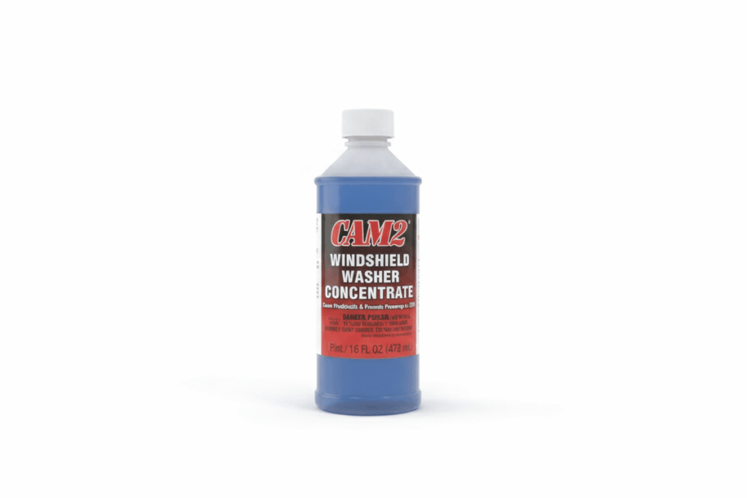 A bottle of Clax windshield washer concentrate with blue liquid.