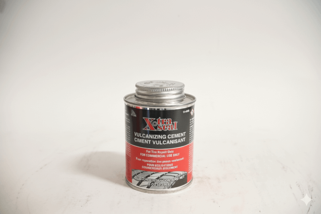 A clear glass jar with a red and black label against a white background.